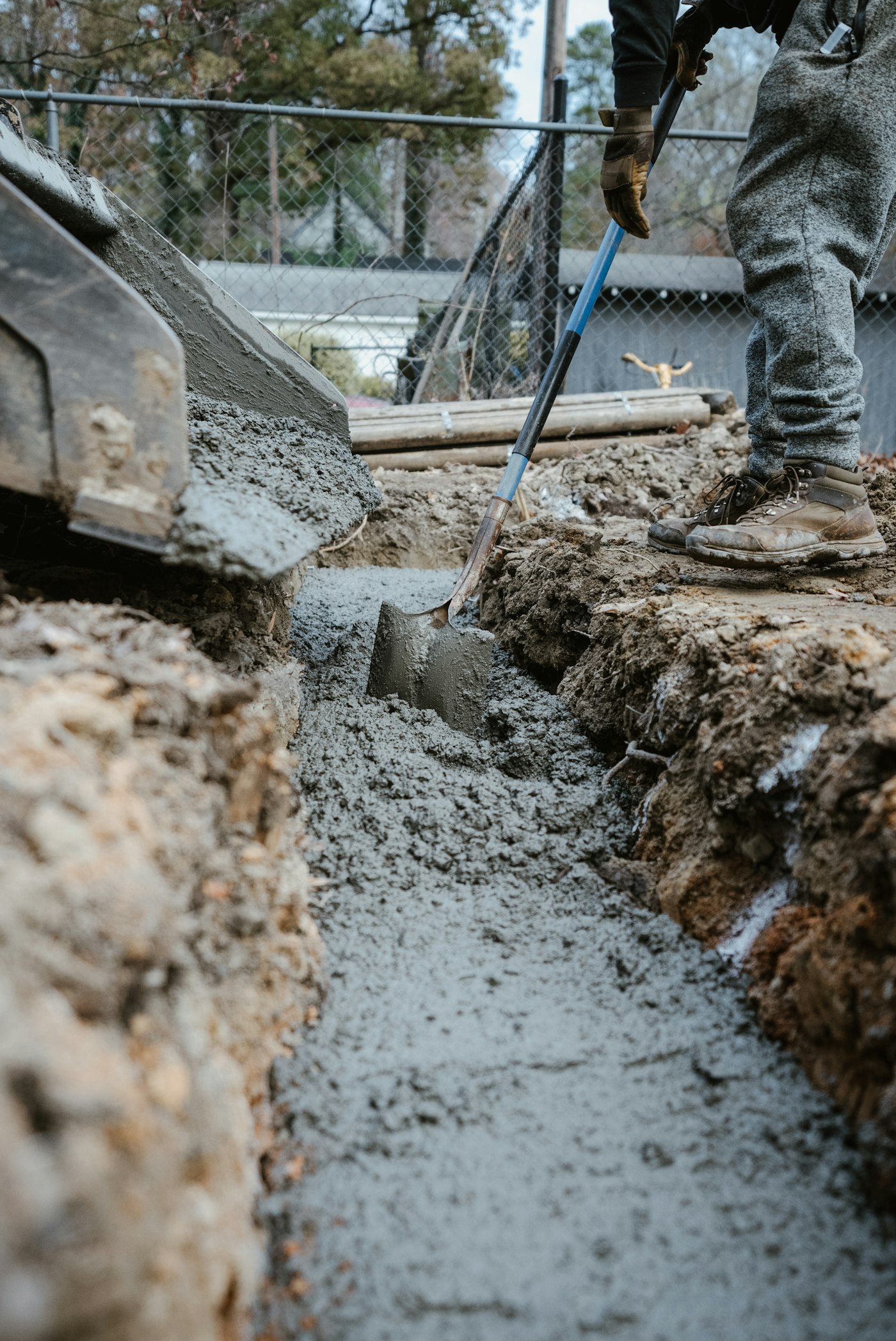 Stock photograph of concrete being poured at a work site